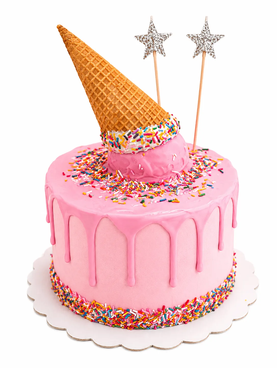 Pink ice cream drip cake with upside down waffle cone and colourful sprinkles