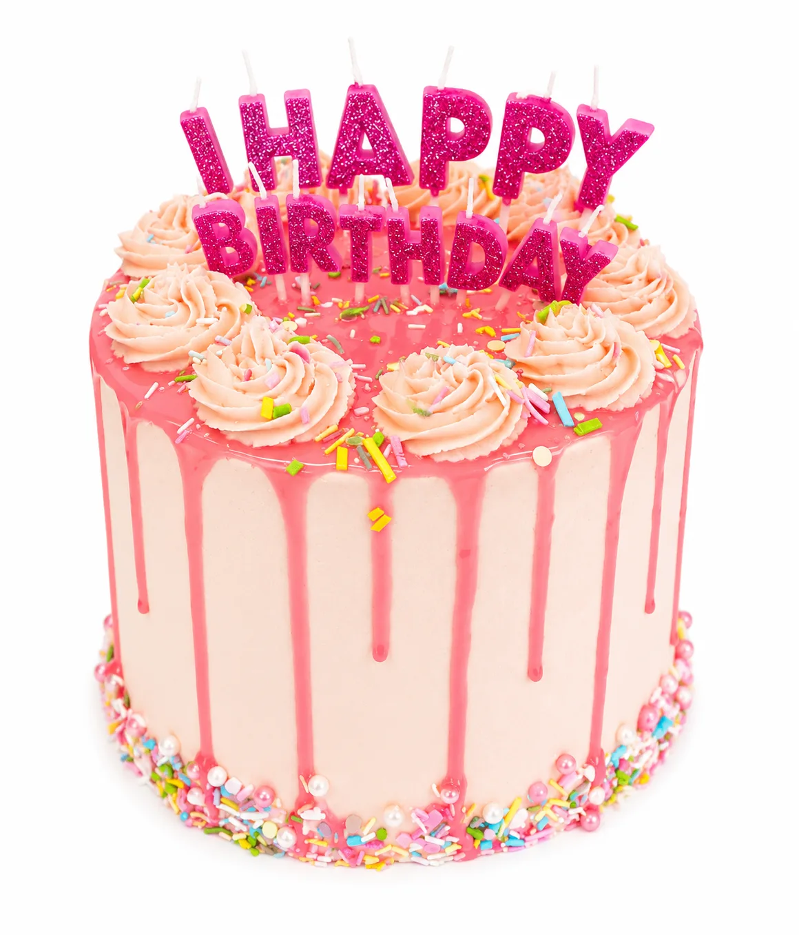 White birthday cake with bright pink drip and happy birthday candles