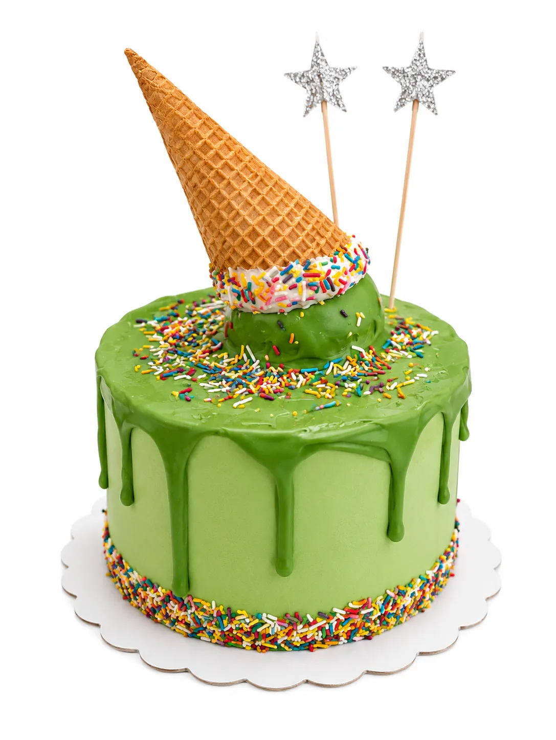 Green drip birthday cake with upside down ice cream cone and rainbow sprinkles