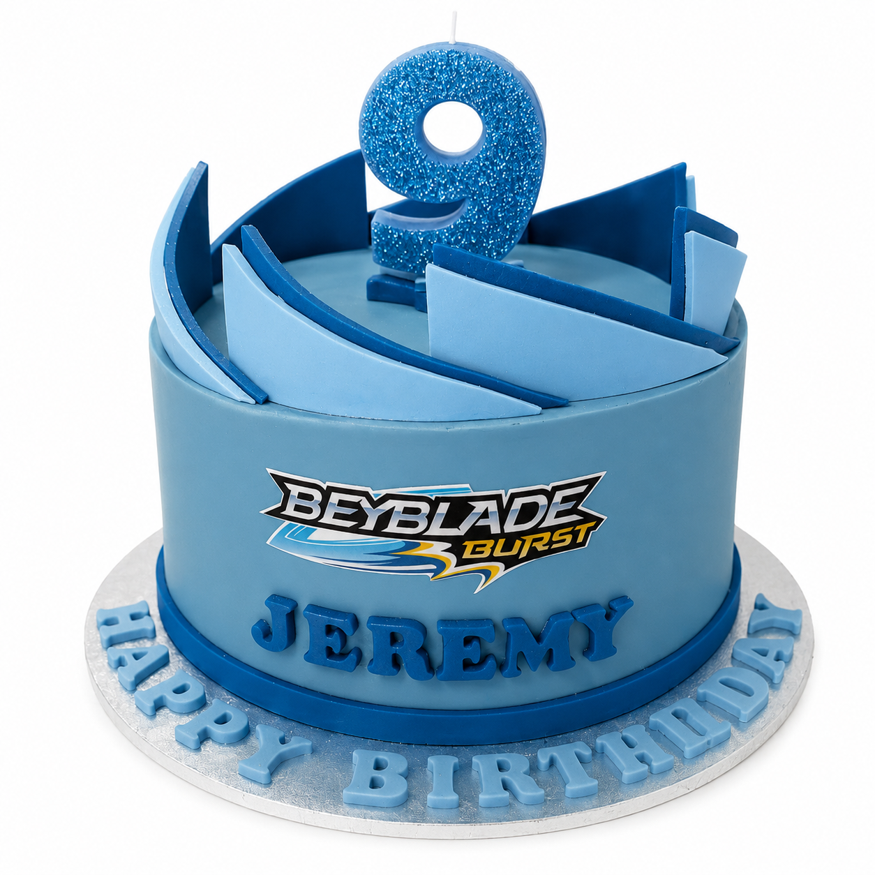 Blue Beyblade themed birthday cake with a glitter number 9 topper